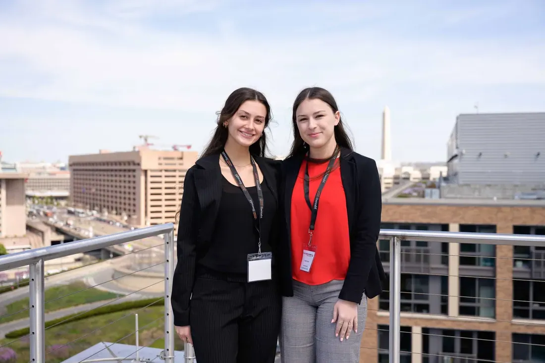 Two students at sustainability offshore wind symposium in Washington, D.C.